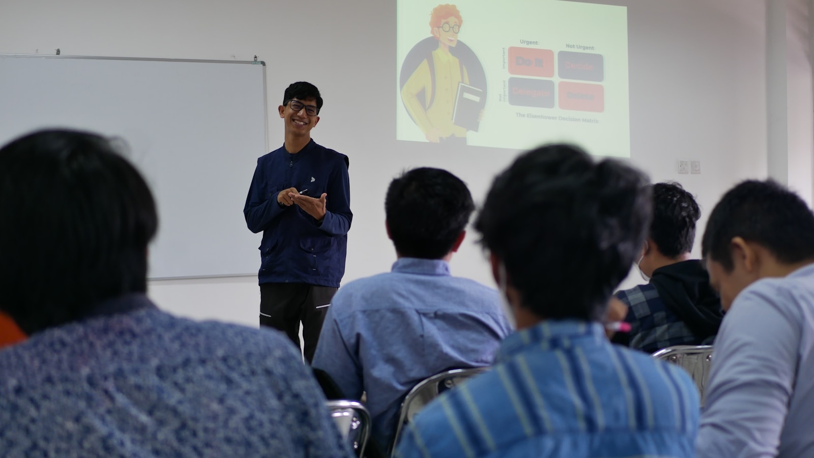 Lecturer to corporate trainer transition — presenter delivering a training session in Malaysia