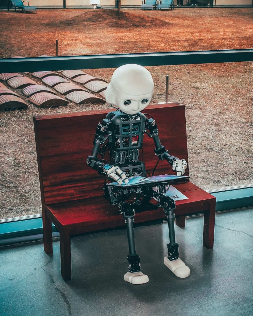Malaysian professional using AI tools on a laptop to boost productivity in 2026