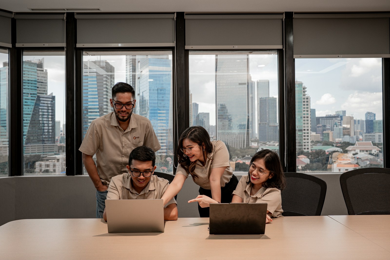 Industry exposure for lecturers — team collaborating in a corporate training session in Malaysia