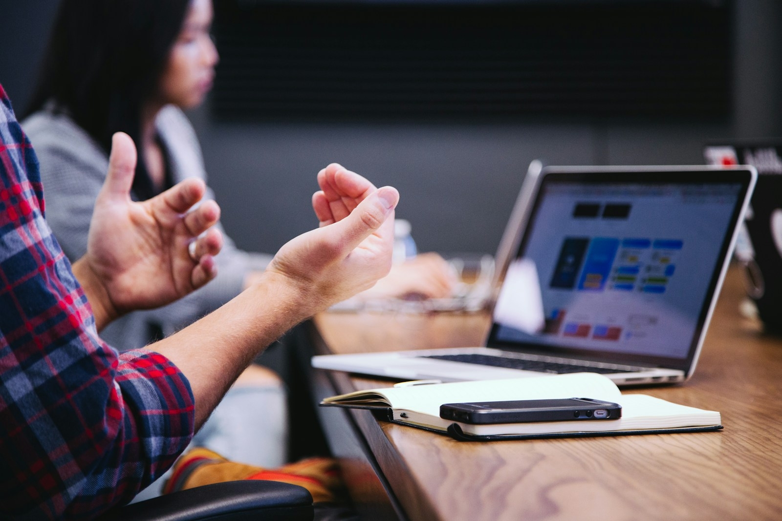 AI coaching session where a Malaysian professional applies AI tools to real work on a laptop