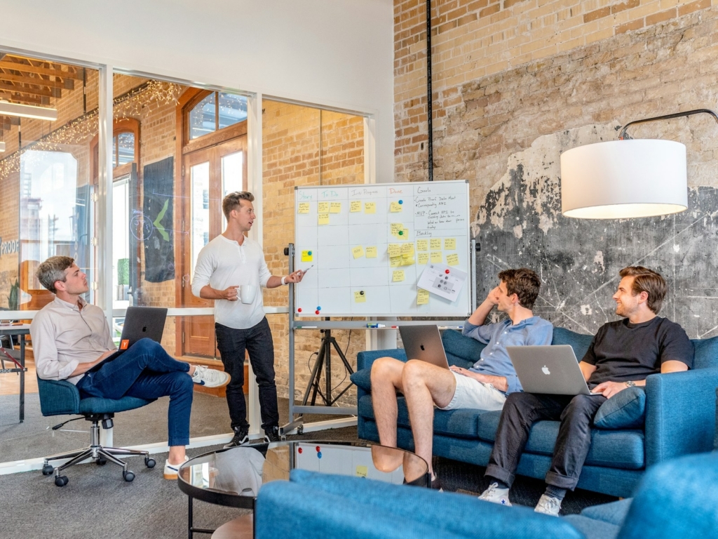 Business team planning a generative AI adoption roadmap in a Malaysian office meeting room