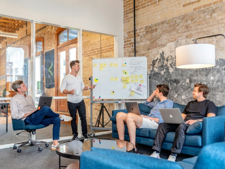 Business team planning a generative AI adoption roadmap in a Malaysian office meeting room