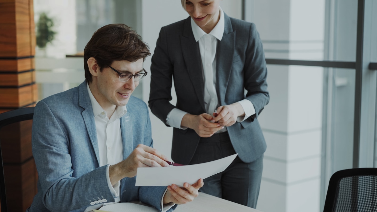 Managers comparing AI training provider proposals in Malaysia