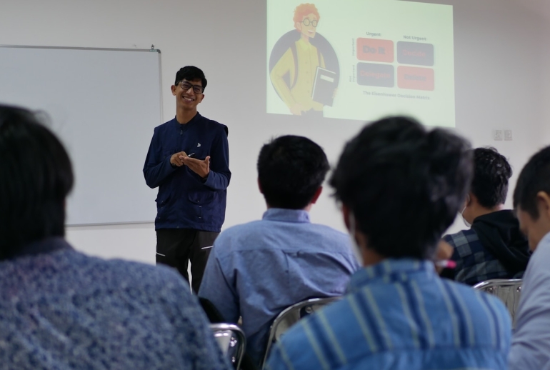 Lecturer to corporate trainer transition — presenter delivering a training session in Malaysia