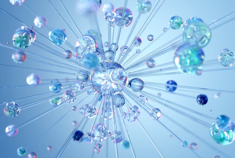 blog.drhariz.com A 3D illustration of transparent and iridescent spheres connected by thin rods, radiating outward on a blue background, resembling a molecular structure—ideal for Pakar AI visuals or Dr Hariz’s work in Malaysia. Dr. Muhamad Hariz Adnan