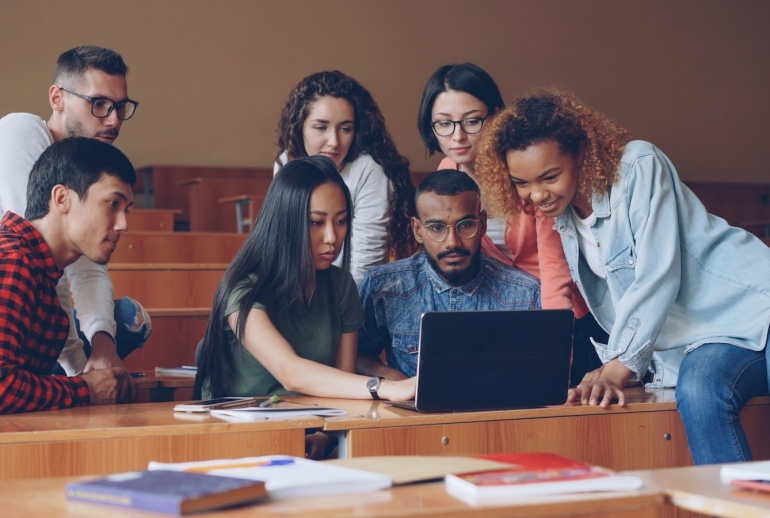 Malaysian students using laptops in class, illustrating AI in education in Malaysia