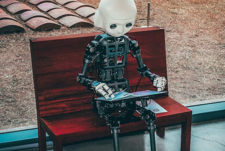 Malaysian professional using AI tools on a laptop to boost productivity in 2026
