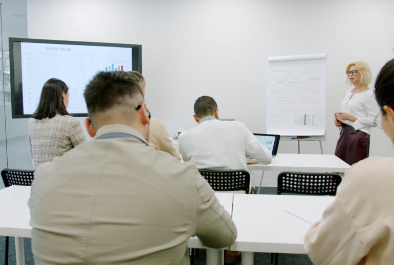Business people in a modern conference room during a presentation.